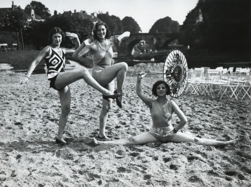 Acrobatic French Women Pose In The Latest Fashionable Bathing Suits On The Sand Beach At Dieppe. Ca. 1925. History - Item # VAREVCHISL041EC205