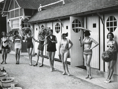 French Women Pose In The Latest Fashionable Bathing Suits Outside Their Beach Cabanas At Dieppe. Ca. 1925. History - Item # VAREVCHISL041EC206