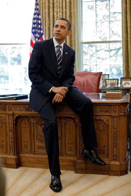 President Barack Obama Sits On The Edge Of The Resolute Desk In The Oval Office. April 30 2010. History - Item # VAREVCHISL025EC075 President Barack Obama Sits On The Edge Of The Resolute Desk In The Oval Office. April 30 2010. History - Item # VAREVCHISL025EC075