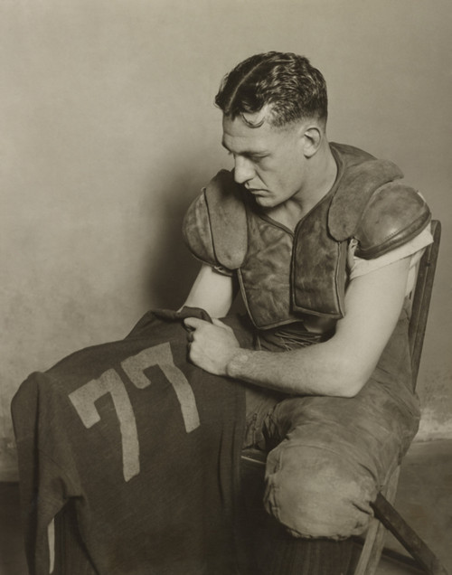 Harold 'Red' Grange Holding His Football Jersey Number. His Number 77 Was Retired At The University Of Illinois In 1925. - History - Item # VAREVCHISL039EC384