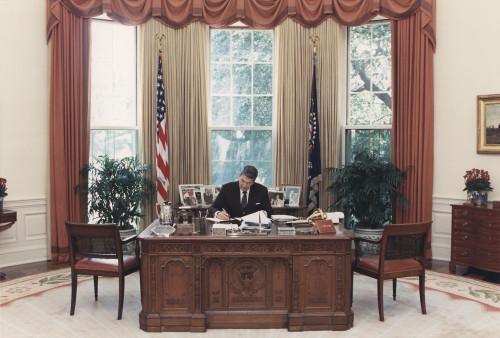 President Reagan Working At His Desk In The Oval Office. July 15 1988. Po-Usp-ReaganNa-12-0101M History - Item # VAREVCHISL023EC095
