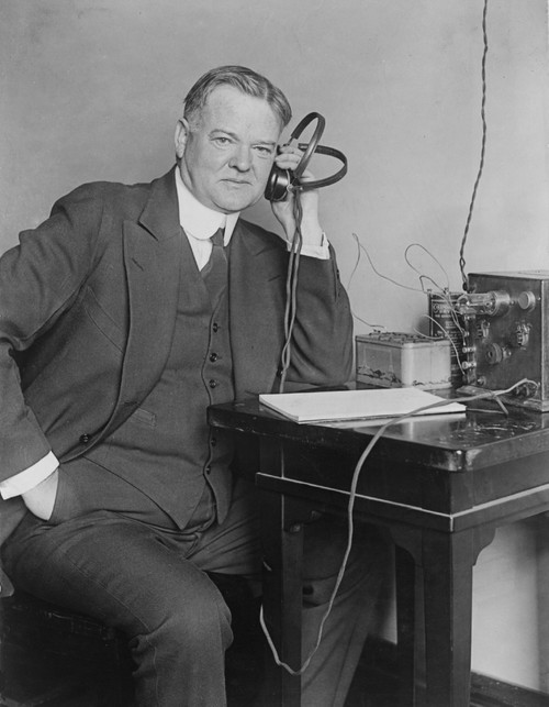 Sec. Of Commerce Herbert Hoover Listening To Radio With Headphones In 1925. Commercial Radio Broadcasts Began In The 1920S. History - Item # VAREVCHISL002EC141