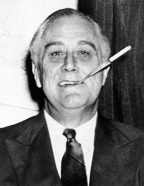President Franklin Roosevelt In His White House Study With His Trademark Long Cigarette Holder. 1943. Csu ArchivesEverett Collection History - Item # VAREVCCSUA000CS087
