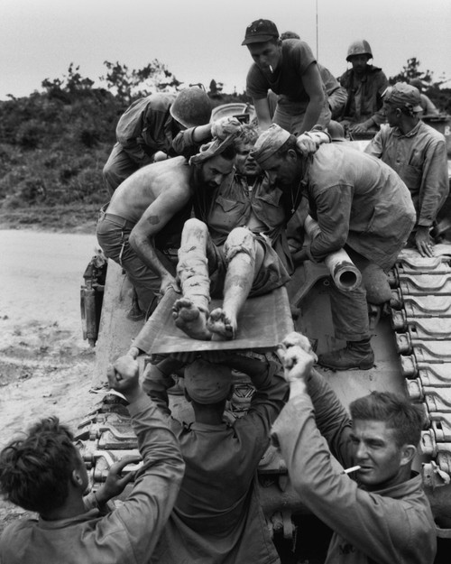 Wounded Marine Is Removed From A Tank That Carried Him From The Front Lines On Okinawa. Fierce Japanese Resistance Made It Impossible For Ambulances To Carry The Wounded To The Rear. April-June 22 History - Item # VAREVCHISL036EC778