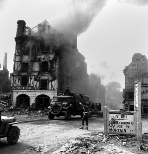 Canadian Soldier Controls Traffic In Burning Falaise Ruins On August 17 History - Item # VAREVCHISL037EC111