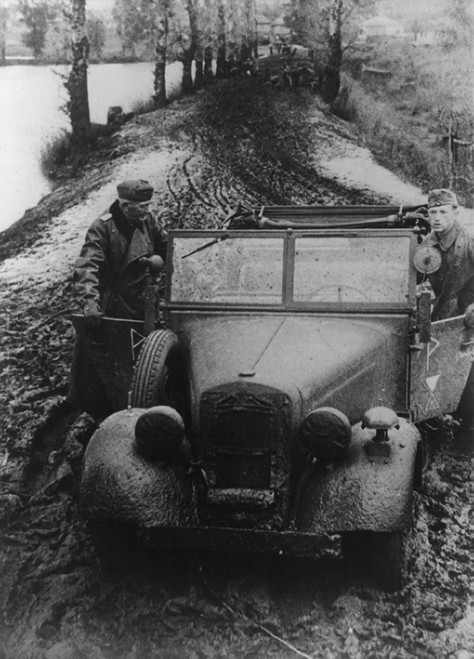 German Soldier And Officer Pushing Their Car Through Russian Mud. In Fall 1941 History - Item # VAREVCHISL036EC597