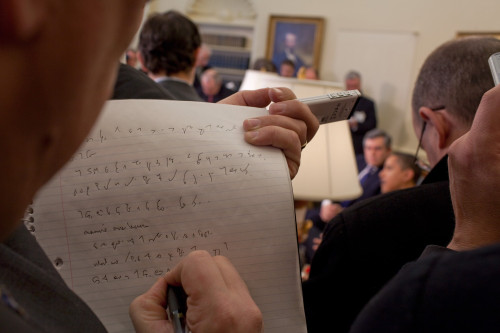 A Reporter Takes Shorthand Notes While President Barack Obama And Prime Minister Gordon Brown Of The United Kingdom Speak To The Press In The Oval Office March 3 2009. History - Item # VAREVCHISL025EC193