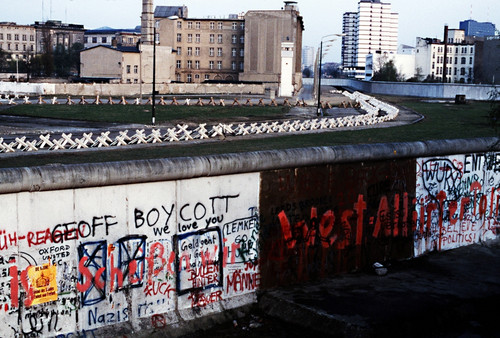 The Berlin Wall Separated Communist-Controlled East Germany From West Berlin. White Apartments Of West Berlin Contrast With The Boarded Up Vacant Brick Buildings Of East Berlin On Righ . June 1 1983. History - Item # VAREVCHISL023EC158