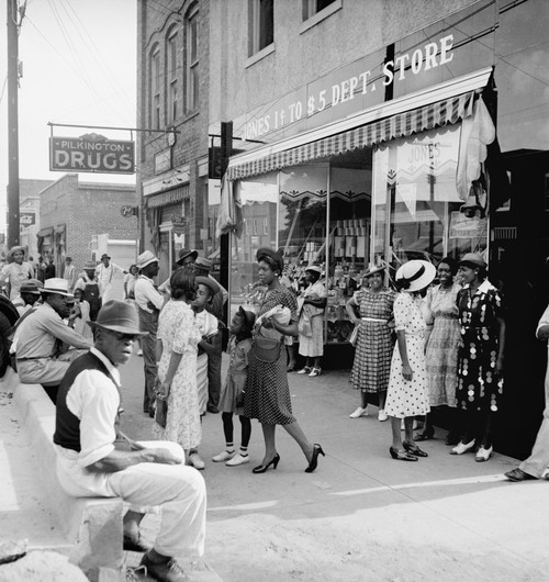 Main Street Shoppers, 1939. /Nafrican American Men And Women Shopping And Socializing On Main Street During A Saturday Afternoon In Pittsboro, North Carolina. Photograph By Dorothea Lange, July 1939. Poster Print by Granger Collection - Item # VARGRC