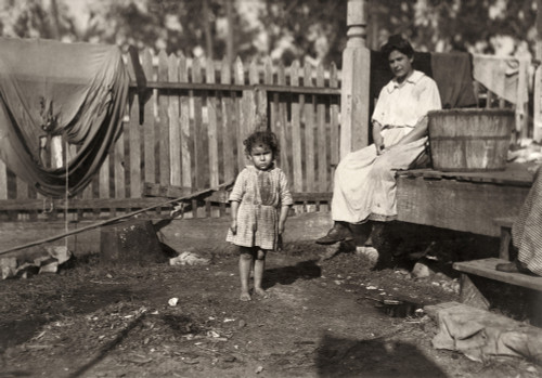 Hine: Poverty, 1911. /Nan Impoverished Mother With Her Three-Year-Old Daughter. Both Of Them Work At The Barataria Canning Company, Biloxi, Mississippi. Photograph By Lewis Hine, February 1911. Poster Print by Granger Collection - Item # VARGRC016677