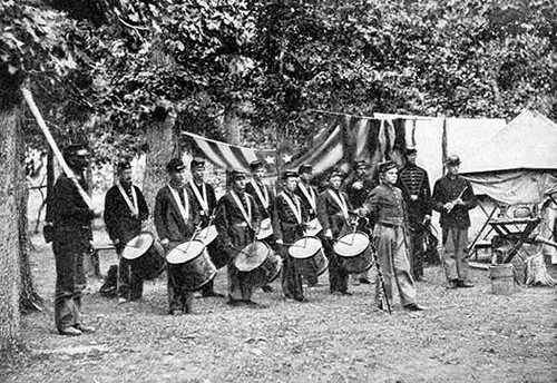 Drummer boys of the 93rd Regiment, New York Volunteer Infantry.  Civil War drummers were an essential part of military bands for obvious reasons: the time they kept was important to regulate the marching of soldiers on parade. Poster Print by unknown