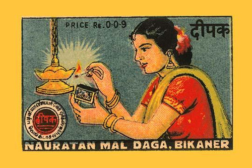 Thousands of companies manufactured matches worldwide and used a variety of fancy labels to make their brand stand out.  The match boxes had unusual topics but some were much prettier than others. This cover features a woman lighting an oil lamp Post