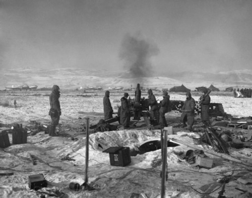 Marine 105Mm Howitzers Defend Hagaru-Ri Airstrip From Chinese Army As Planes Evacuate Wounded. Guns Fire Right Over Airfield Into Nearby Hills As Main Body Of 1St Marine Division Returns From Chosin Reservoir Area From Yudam-Ni. Nov. - Item # VAREVCH