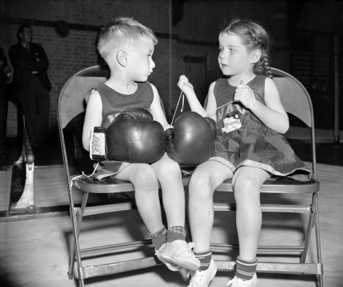 Junior Boxer, 1939. /Ndorothy Wood, Age 5, Laces The Boxing Gloves Of Her Companion, Chuck Andrews, Age 3, At The U.S. Naval Academy'S 20Th Annual Junior Boxing Championships, In Annapolis, Maryland, 1939. Poster Print by Granger Collection - Item #
