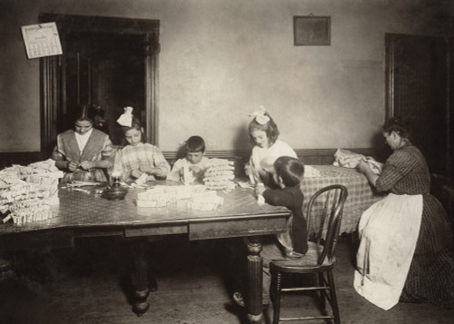Hine: Home Industry, 1912. /Na Mother And Her Young Children Doing Piecework For Garments, Often Until 9 P.M. At Night In A Tenement Home In Worcester, Massachusetts. Photograph By Lewis Hine, November 1912. Poster Print by Granger Collection - Item