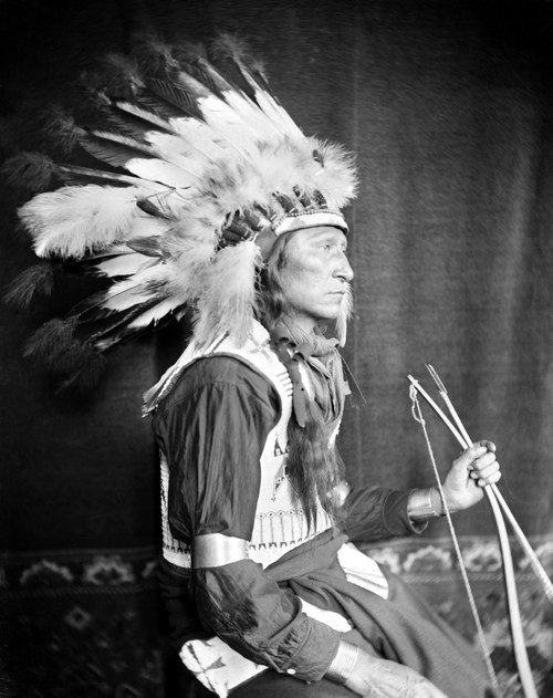 Sioux Chief, C1900. /Nchief Lone Bear, An Oglala Sioux Native American From Buffalo Bill'S Wild West Show, Wearing A Breastplate And War Bonnet, And Holding A Bow And Arrow. Photograph By Gertrude K_Sebier, C1900. Poster Print by Granger Collection -