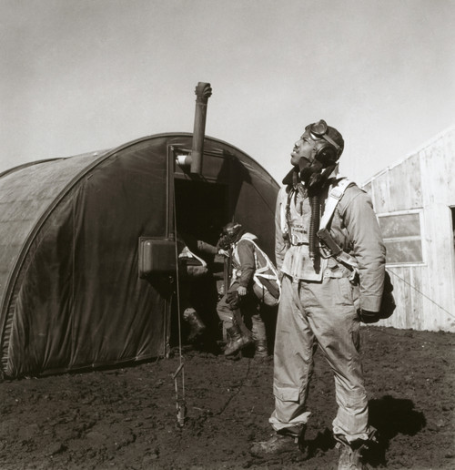 Wwii: Tuskegee Airman, 1945. /Nfighter Pilot Newman Golden Of The Tuskegee Airmen Scans The Skies. Behind Him Is The Parachute Room, At Ramitelli Airfield, Italy. Photograph By Toni Frissell, March 1945. Poster Print by Granger Collection - Item # VA