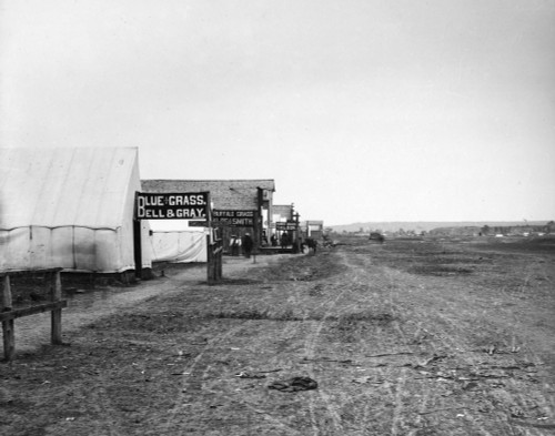 Montana: Miles City, C1880. /Nview Of A Street In Miles City, Montana, Showing Signs Promoting The Sale Of Blue Grass And Buffalo Grass, And A Saloon Farther Down The Road. Photographed By L.A. Huffman, C1880. Poster Print by Granger Collection - Ite Montana: Miles City, C1880. /Nview Of A Street In Miles City, Montana, Showing Signs Promoting The Sale Of Blue Grass And Buffalo Grass, And A Saloon Farther Down The Road. Photographed By L.A. Huffman, C1880. Poster Print by Granger Collection - Ite
