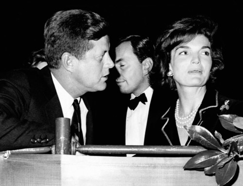 President John Kennedy And Wife Jacqueline Attend The Washington International Horse Show. Mrs. Kennedy Presented The President'S Perpetual Championship Cup To The Winning Jumper At The Show. In Background Is Gore Vidal History - Item # VAREVCCSUA001