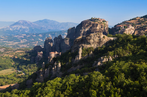 Meteora, Thessaly, Greece. Panorama showing four of the six monasteries still used. From left St Nicholas, Rousanou or Roussanou, Varlaam and The Great Meteora. Meteroa is a UNESCO World Heritage Site. Poster Print by Panoramic Images - Item # VARPPI
