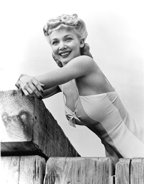 Carole Landis - leaning on wood in athing suit Photo Print (8 x 10) - Item # DAP14416