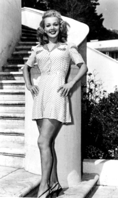 Carole Landis - posed at base of stairs Photo Print (8 x 10) - Item # DAP14511