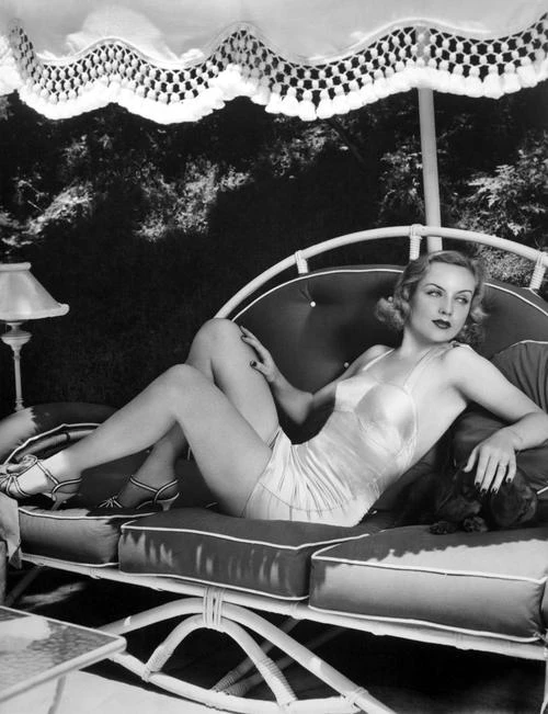 Carole Lombard - lounging on outdoor couch Photo Print (8 x 10) - Item # DAP14606