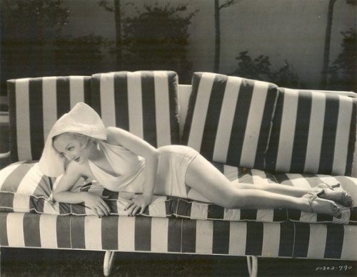 Carole Lombard - on striped couch Photo Print (8 x 10) - Item # DAP14579