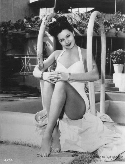 Cyd Charisse - holding handles on pool ladder Photo Print (8 x 10) - Item # DAP15934