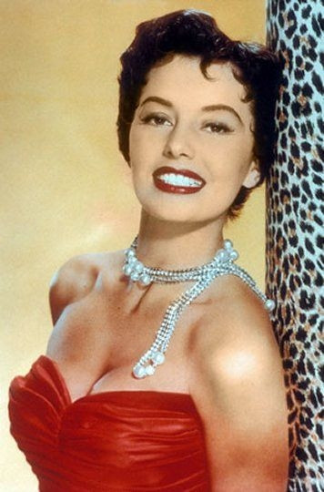 Cyd Charisse - leaning on animal print color Photo Print (8 x 10) - Item # DAP15900