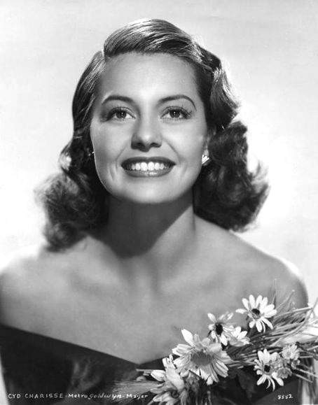Cyd Charisse - smiling with flowers Photo Print (8 x 10) - Item # DAP15863
