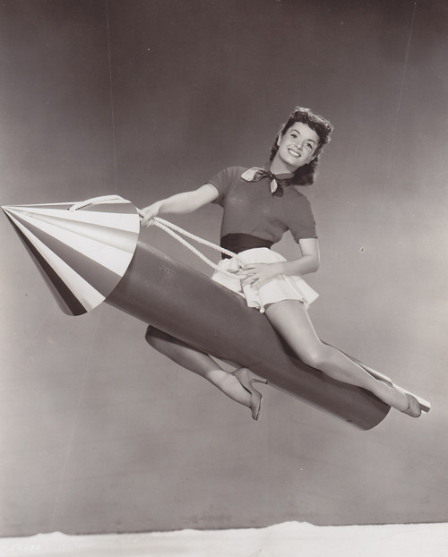 Debbie Reynolds- Sitting on a rocket (prop) Photo Print (8 x 10) - Item # DAP16472