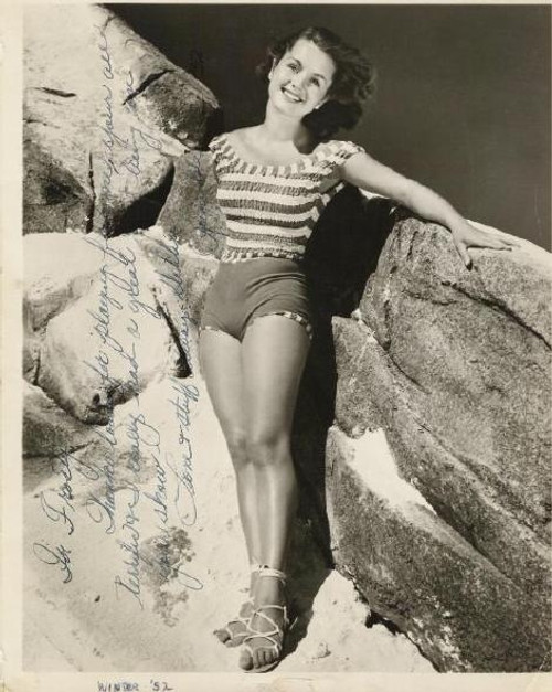 Debbie Reynolds- Standing next to rocks Photo Print (8 x 10) - Item # DAP16498