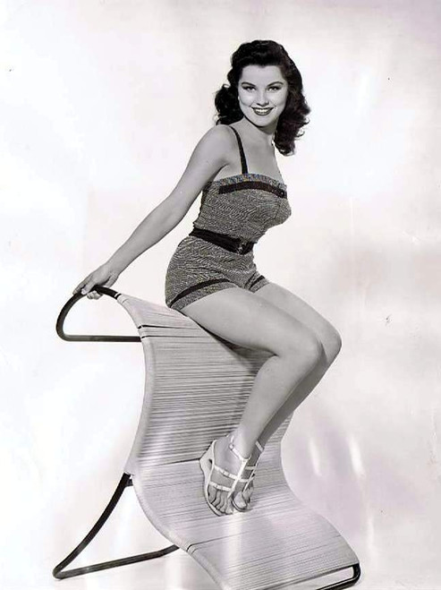 Debra Paget- In a one piece sitting on a chair Photo Print (8 x 10) - Item # DAP16718