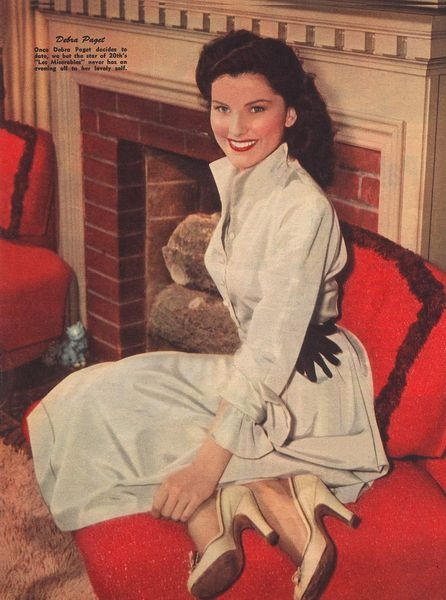 Debra Paget- Sitting on red chair Photo Print (8 x 10) - Item # DAP16648