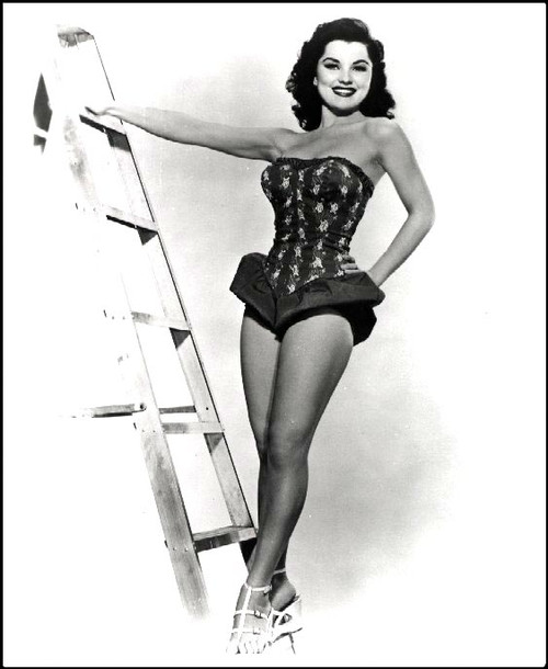 Debra Paget- Standing on ladder hand on hip Photo Print (8 x 10) - Item # DAP16538
