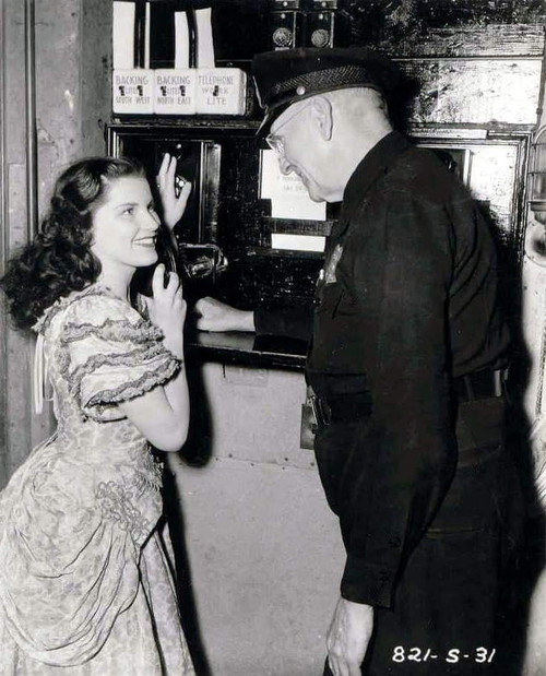 Debra Paget- Talking to an older man Photo Print (8 x 10) - Item # DAP16749