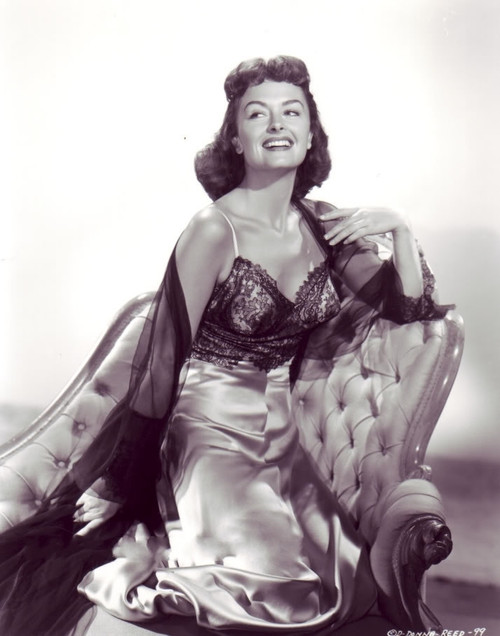 Donna Reed - In Dress Kneeling on Chair Photo Print (8 x 10) - Item # DAP17049