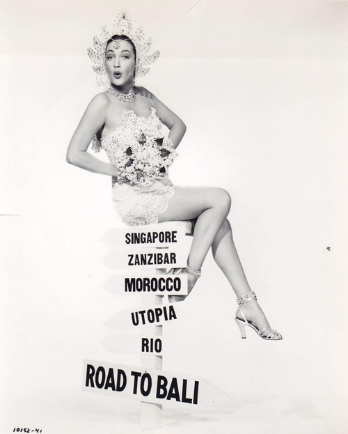 Dorothy Lamour - Sitting on Road to Bali Sign Photo Print (8 x 10) - Item # DAP17202