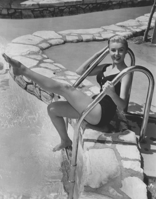 Elaine Stewart - Sitting on Ladder Poolside Photo Print (8 x 10) - Item # DAP17594