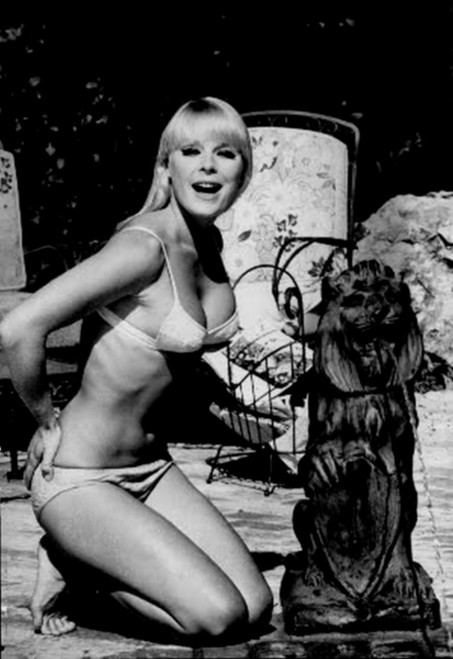 Elke Sommer - Kneeling Near Lion Statue Photo Print (8 x 10) - Item # DAP17851