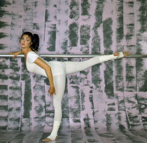 Lynda Carter - Leg on Poll in White Unitard Photo Print (8 x 10) - Item # DAP18750