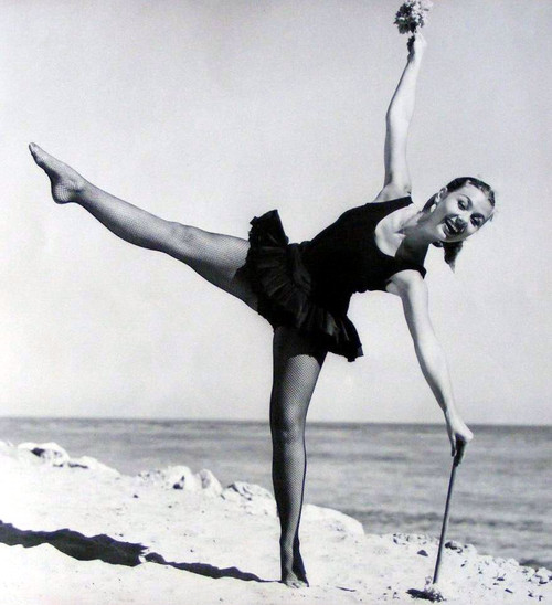 Mitzi Gaynor - Dancing on Beach with Shovel Photo Print (8 x 10) - Item # DAP19106