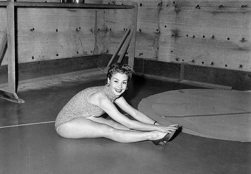 Mitzi Gaynor - Stretching Sitting Photo Print (10 x 8) - Item # DAP19057