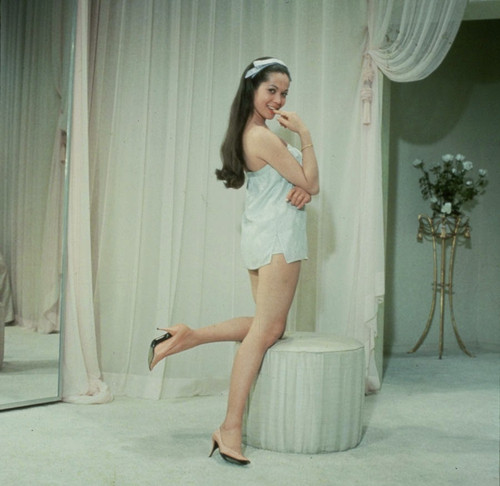 Nancy Kwan - Knee Up on Ottoman Photo Print (8 x 10) - Item # DAP19558