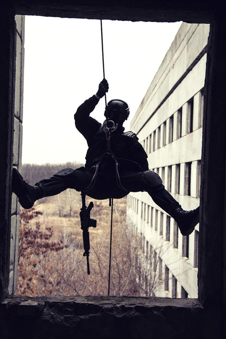 Spec ops police officer SWAT during rope exercises with weapons. Poster Print by Oleg Zabielin/Stocktrek Images (11 x 17 - Item # VARPSTZAB100614M