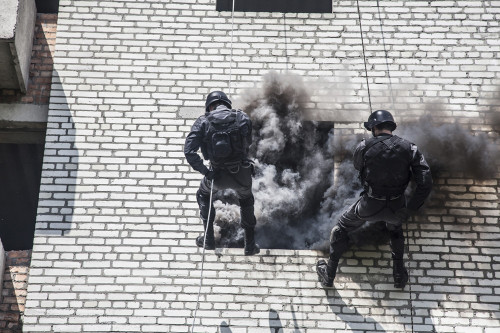 Spec ops police officers SWAT during assault operation. Poster Print by Oleg Zabielin/Stocktrek Images - Item # VARPSTZAB101259M