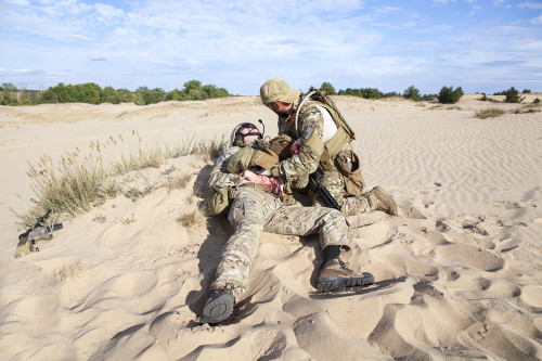 U.S. Army Special Forces soldier medic treating the wounds of an injured soldier. Poster Print by Oleg Zabielin/Stocktre - Item # VARPSTZAB101447M