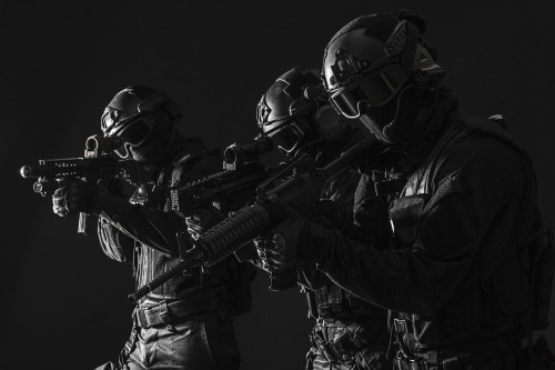 Spec ops police officers SWAT in black uniform and face mask, studio shot. Poster Print by Oleg Zabielin/Stocktrek Image - Item # VARPSTZAB101480M