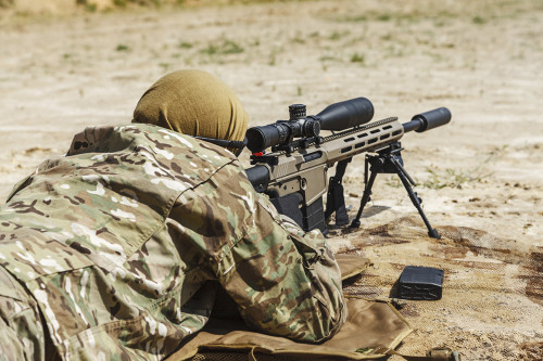 Young male sniper in camouflage with gun in the desert. Poster Print by Oleg Zabielin/Stocktrek Images - Item # VARPSTZAB101818M
